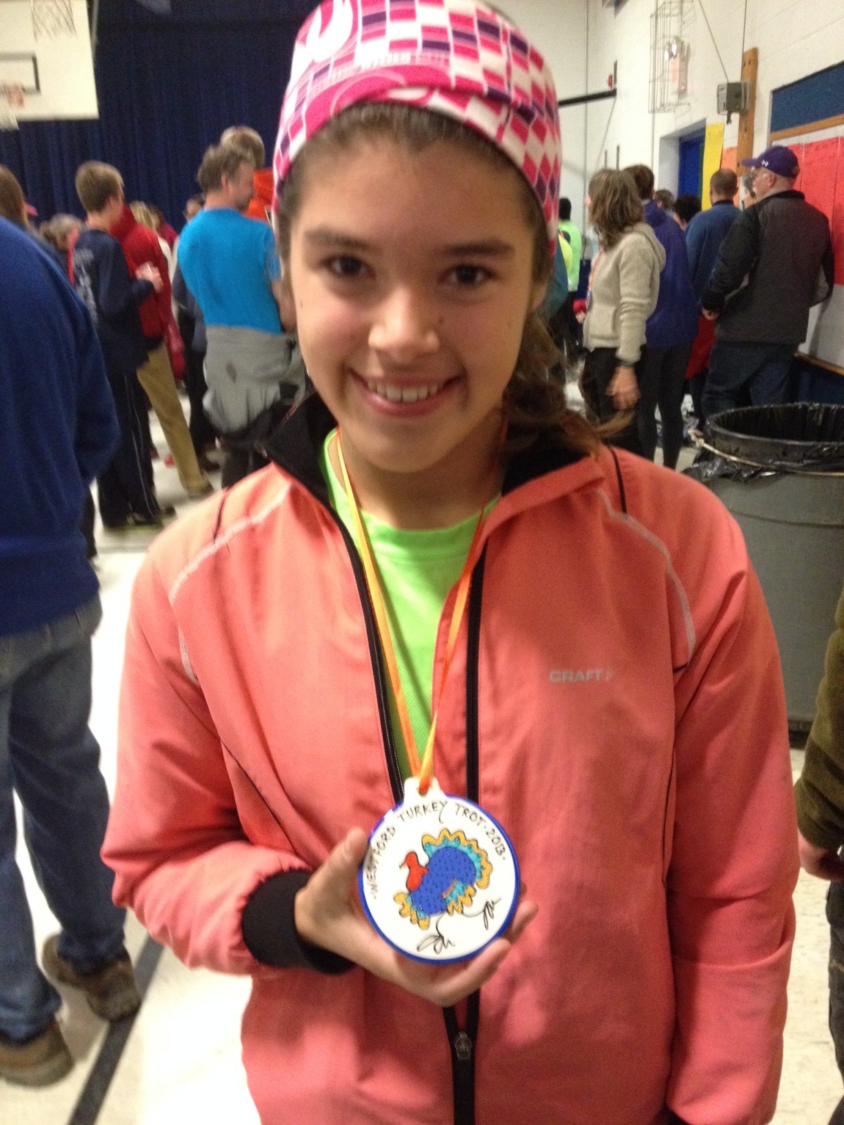 Amy Bruce with her cool medal for first place in the girls 15-19 division in the 10km