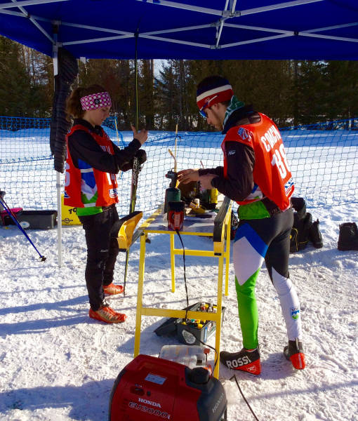 Coach Sara and Coach Adam klistering furiously