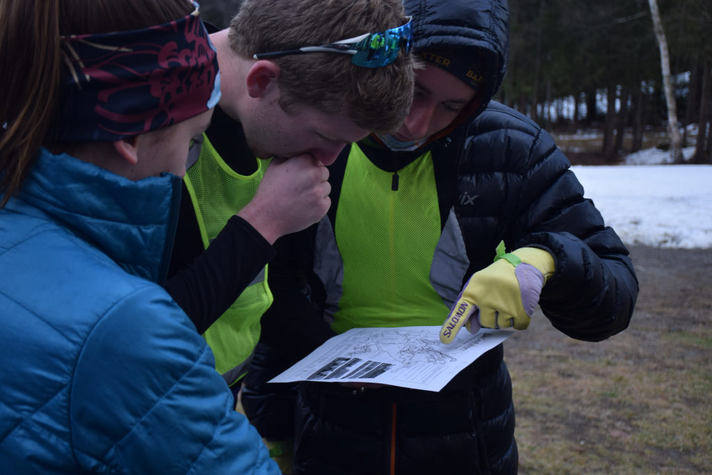 With the Craftsbury Opener cancelled, we had to get creative with our final day. The event? "Team Triathlon Challenge" where teams of 3 each tackled the following: 10k orienteering trail run, 75 laps of the loop, 100 pullups, and 6k of SkiErging. Here are eventual-champions Ali, Tim, and Baxter checking out the trail map before the run