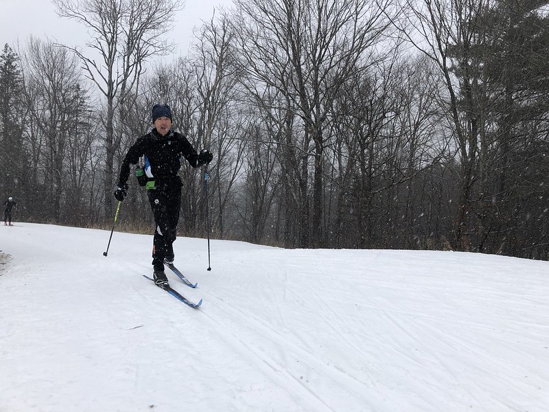 Pascal cruising up by the cabins in some fresh snow